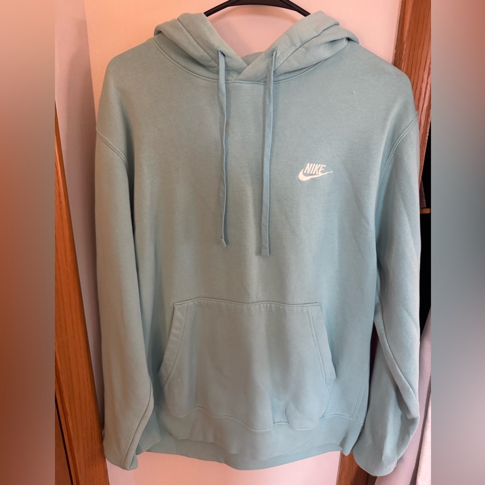 Turquoise/ blue Nike sweatshirt.